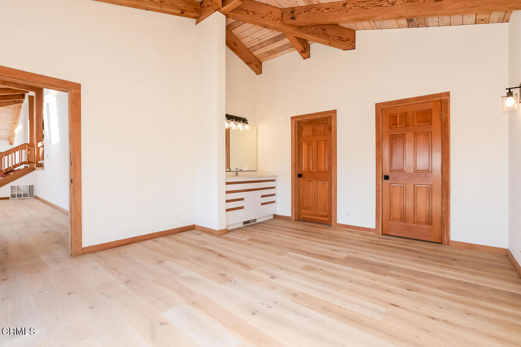 45460 Indian Shoals Road Mendocino, CA 95460 - Photo 14 of 50 a view of an empty room with wooden floor and a window