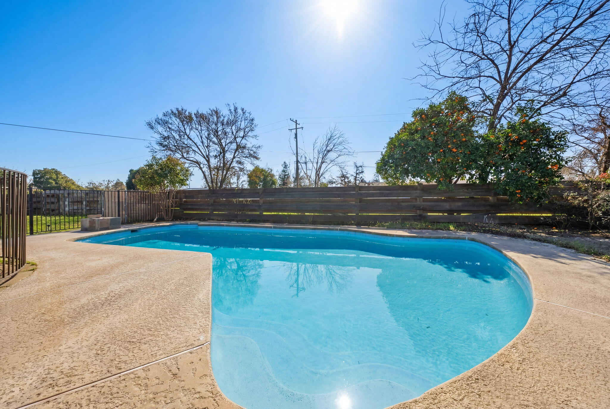 13520 Crystal Street Red Bluff, CA 96080 - Photo 20 of 24 a view of a swimming pool with an outdoor space and seating area