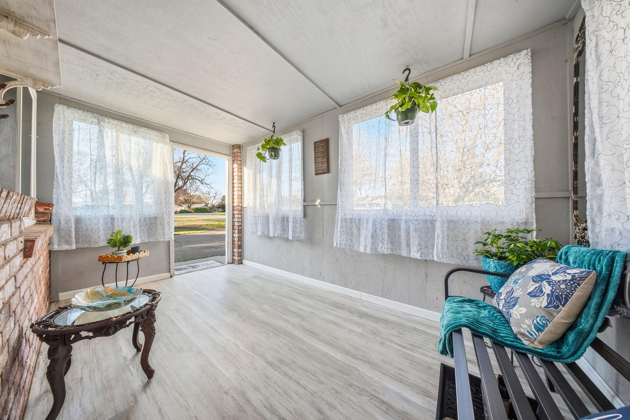 13520 Crystal Street Red Bluff, CA 96080 - Photo 2 of 24 a living room with furniture and a potted plant