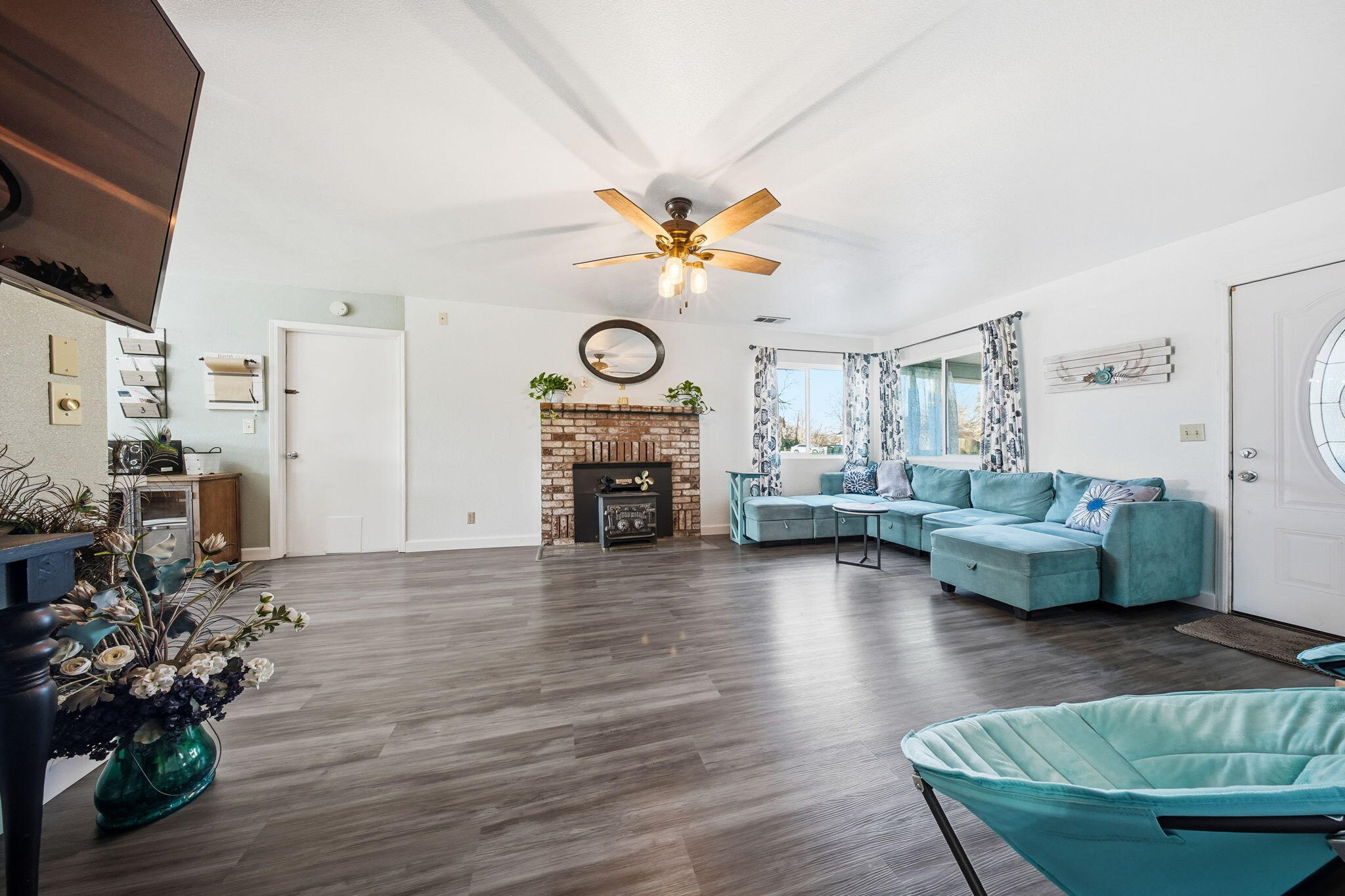 13520 Crystal Street Red Bluff, CA 96080 - Photo 4 of 24 a living room with furniture and a fireplace