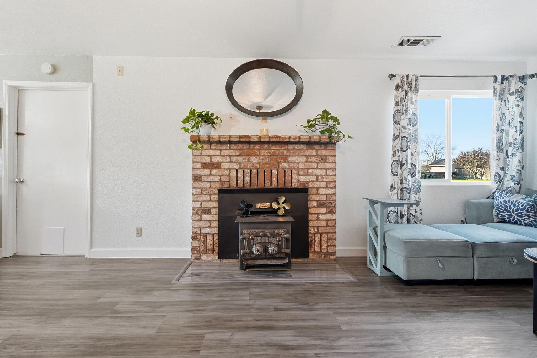 13520 Crystal Street Red Bluff, CA 96080 - Photo 5 of 24 a living room with furniture and a fireplace