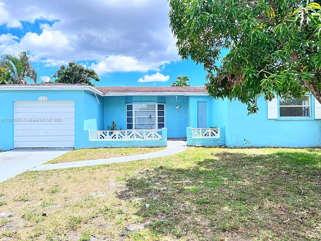 a house view with a backyard space
