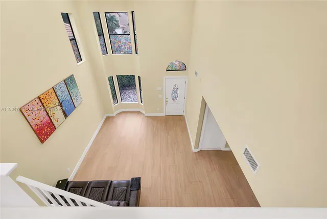 a view of an entryway with wooden floor