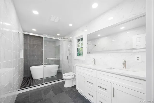 a white bath tub sitting in a bathroom