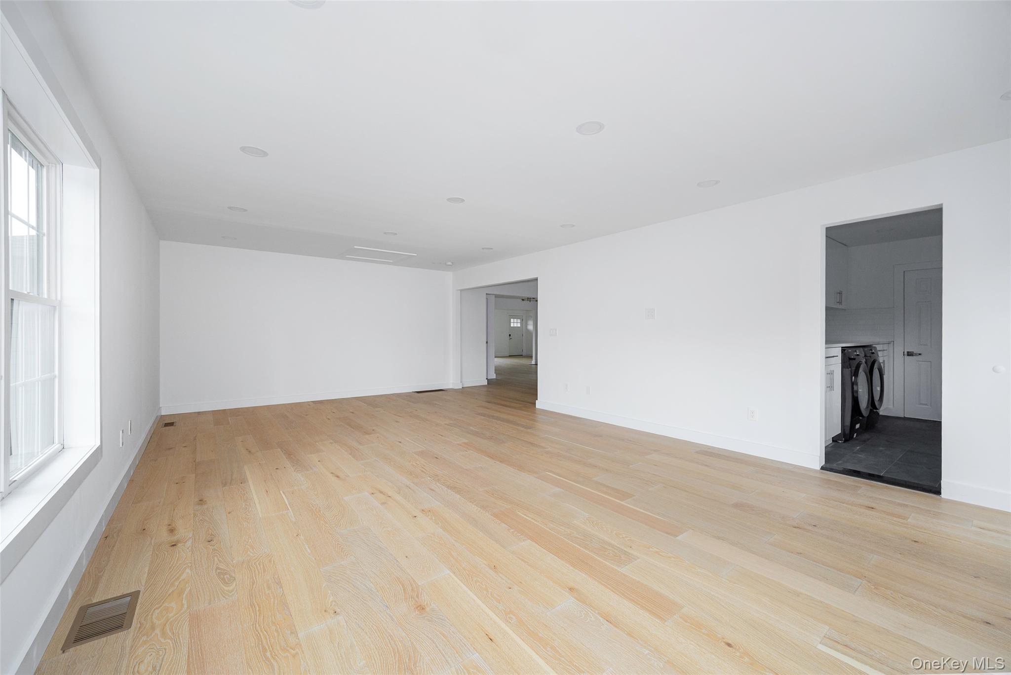 382 Slate Quarry Road Rhinebeck, NY 12572 - Photo 20 of 31 a view of an empty room and window and wooden floor