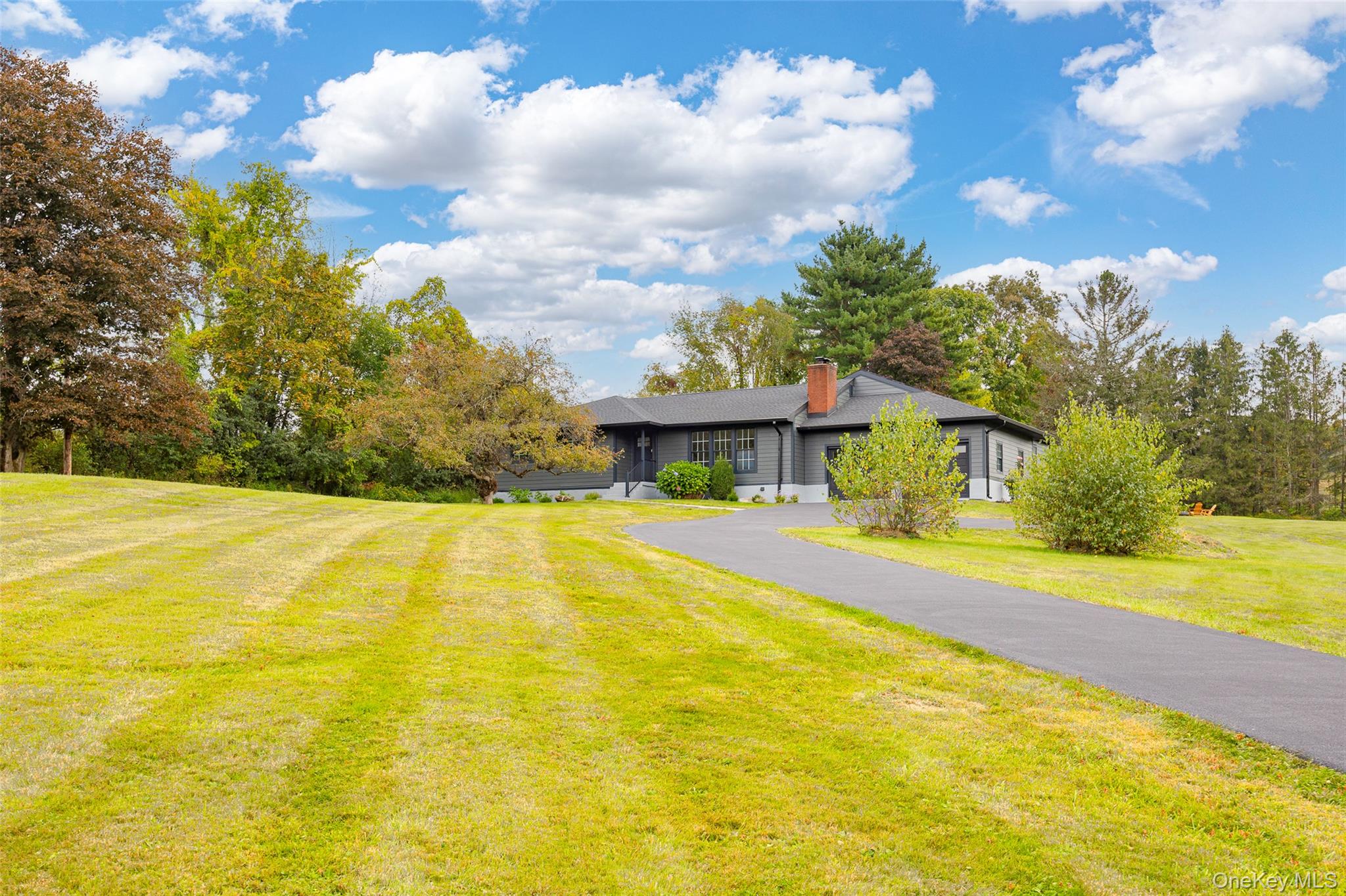 382 Slate Quarry Road Rhinebeck, NY 12572 - Photo 2 of 31 a view of a swimming pool with an outdoor space and seating area