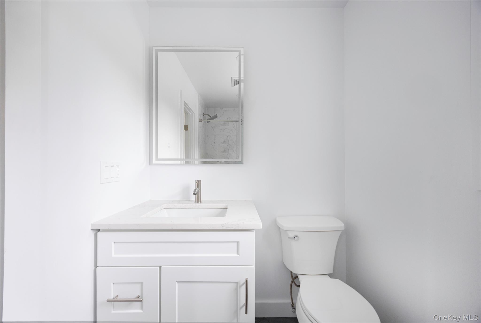 382 Slate Quarry Road Rhinebeck, NY 12572 - Photo 23 of 31 a bathroom with a toilet sink and mirror