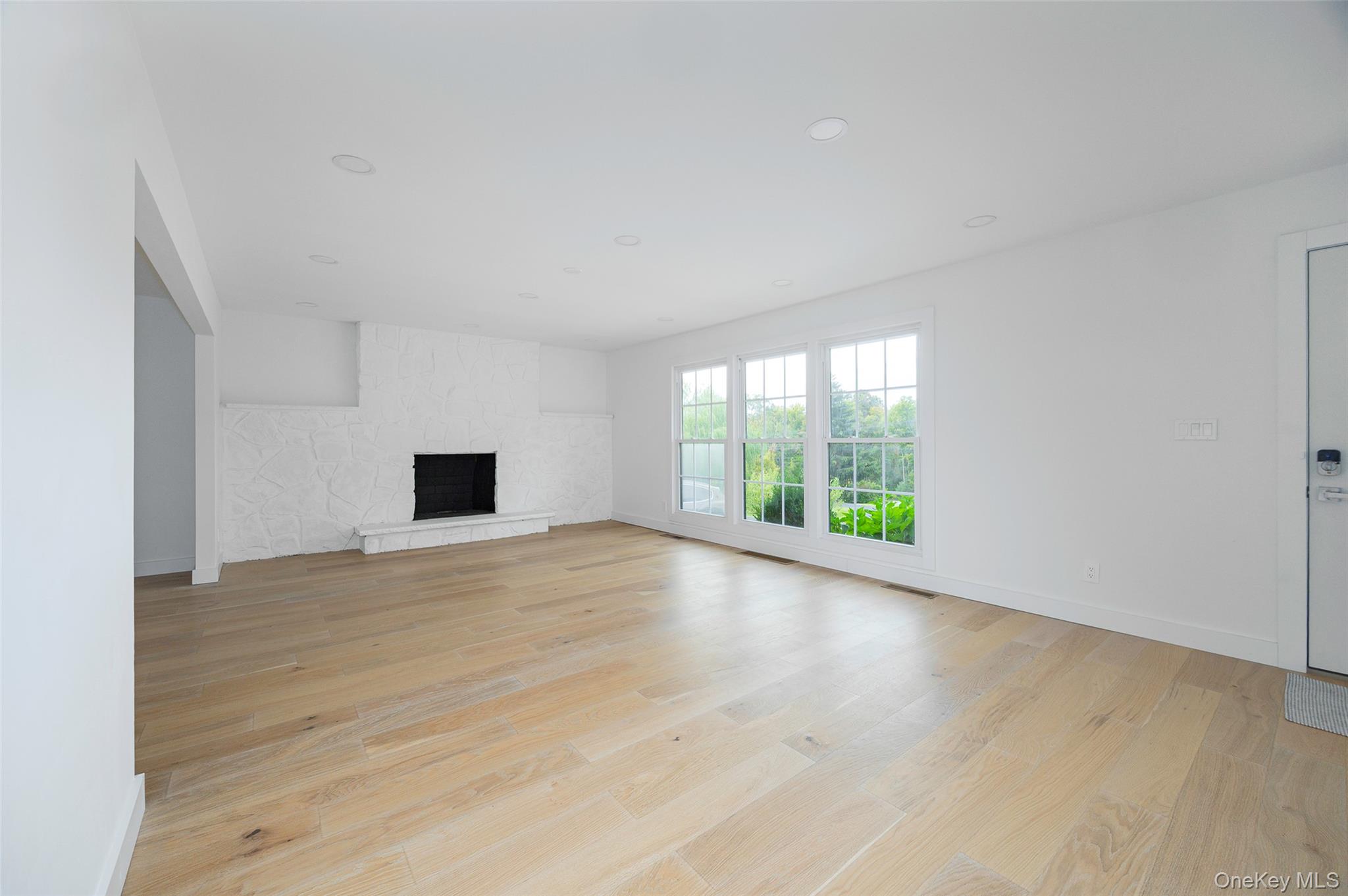382 Slate Quarry Road Rhinebeck, NY 12572 - Photo 5 of 31 a view of an empty room with wooden floor and a window