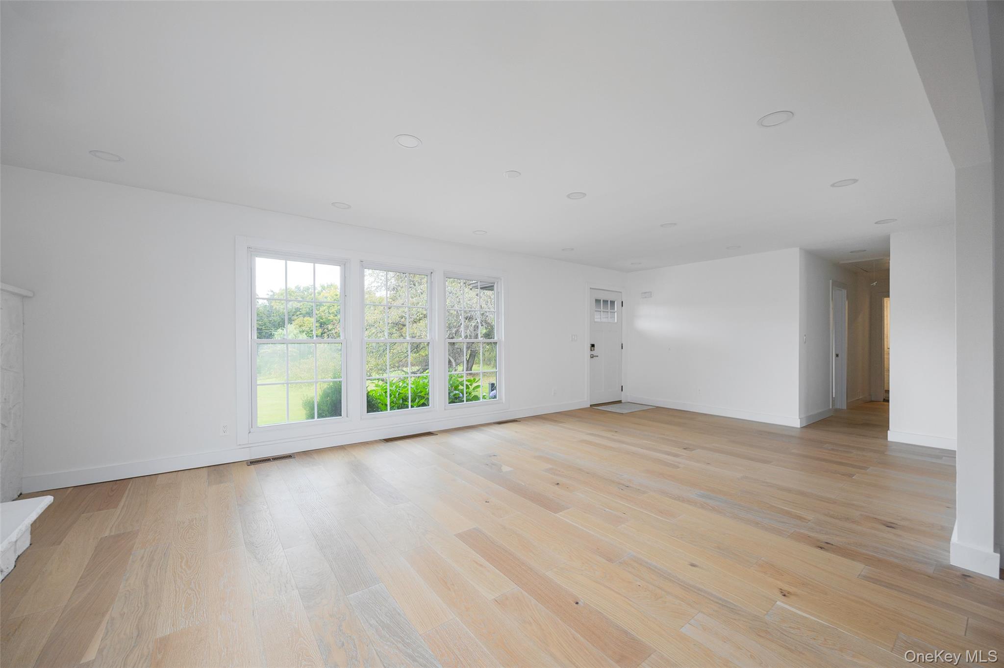 382 Slate Quarry Road Rhinebeck, NY 12572 - Photo 6 of 31 a view of an empty room with wooden floor and a window