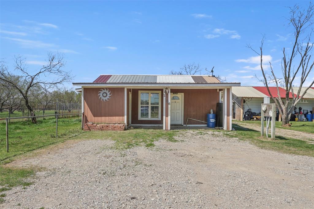 1556 John Wayne Road Kaufman, TX 75142 - Photo 21 of 33 a view of a house with a yard and large tree