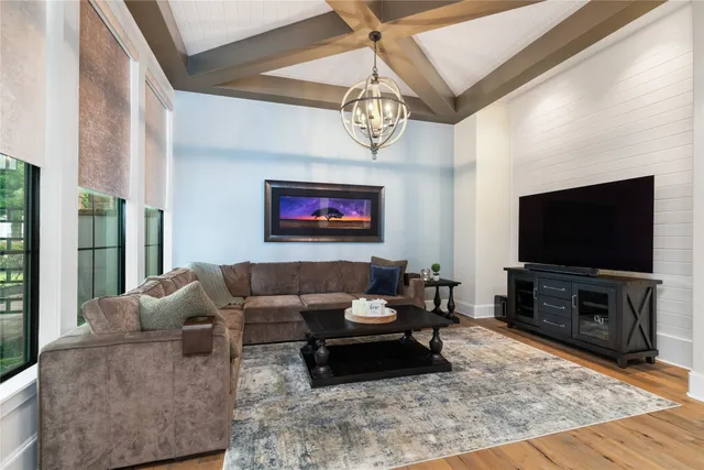 a living room with furniture and a flat screen tv
