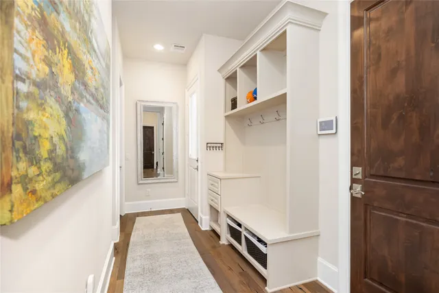 a white refrigerator freezer and a stove sitting inside of a kitchen
