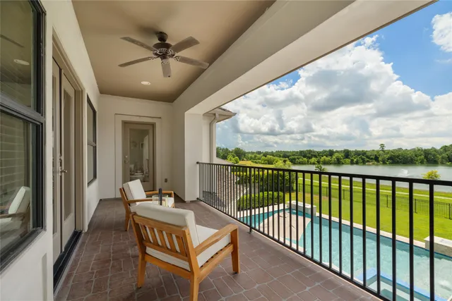 a view of a balcony with furniture