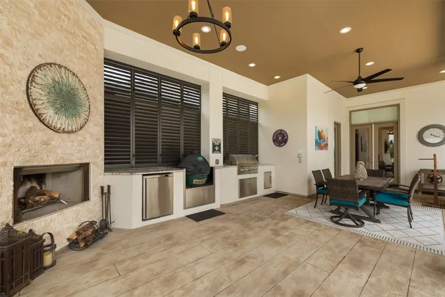 a view of a livingroom with furniture and a large window