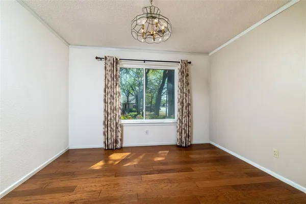 a bed room with furniture and a large window