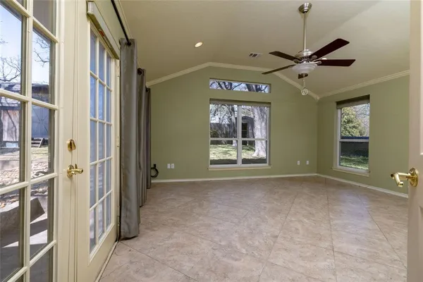 a view of an empty room with a window