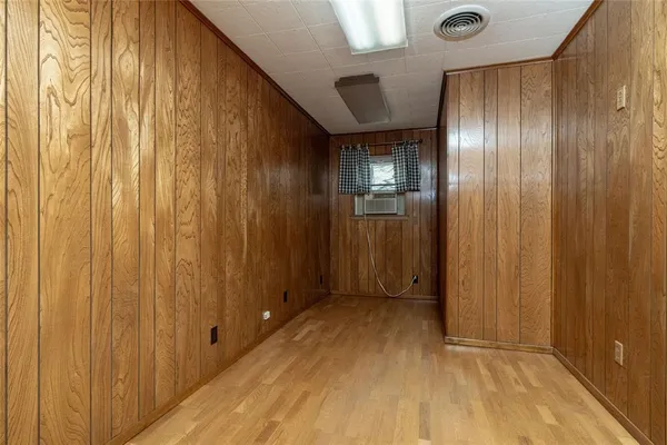 a spacious bathroom with a double vanity sink a mirror a toilet and a bathtub