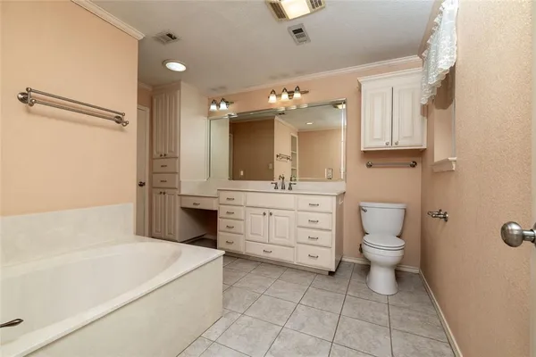 a white bath tub sitting in a bathroom