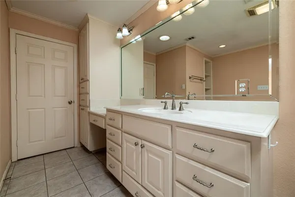 a view of house with yard and trees in the background