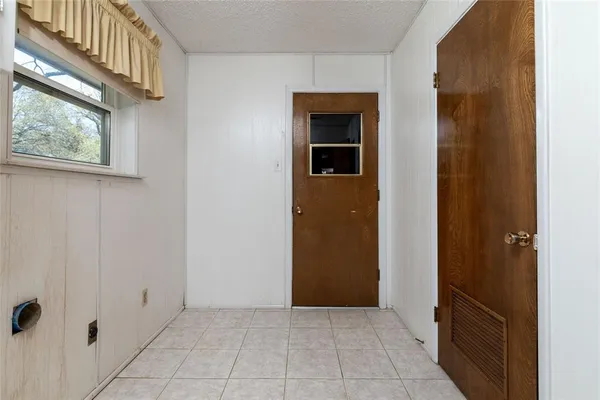 a view of a house with snow on the wall