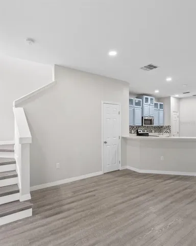 a view of kitchen with wooden floor