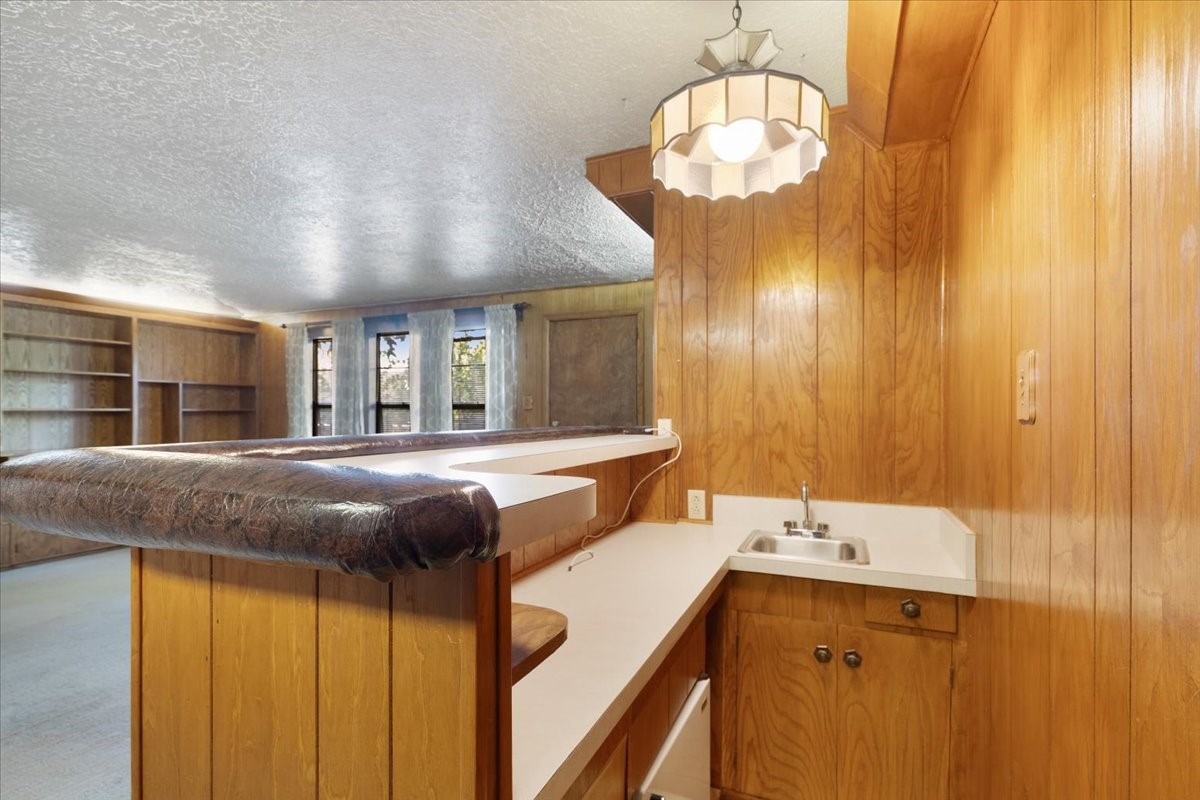 1403 Marlock Lane Pasadena, TX 77502 - Photo 13 of 32 a bathroom with a sink and a mirror