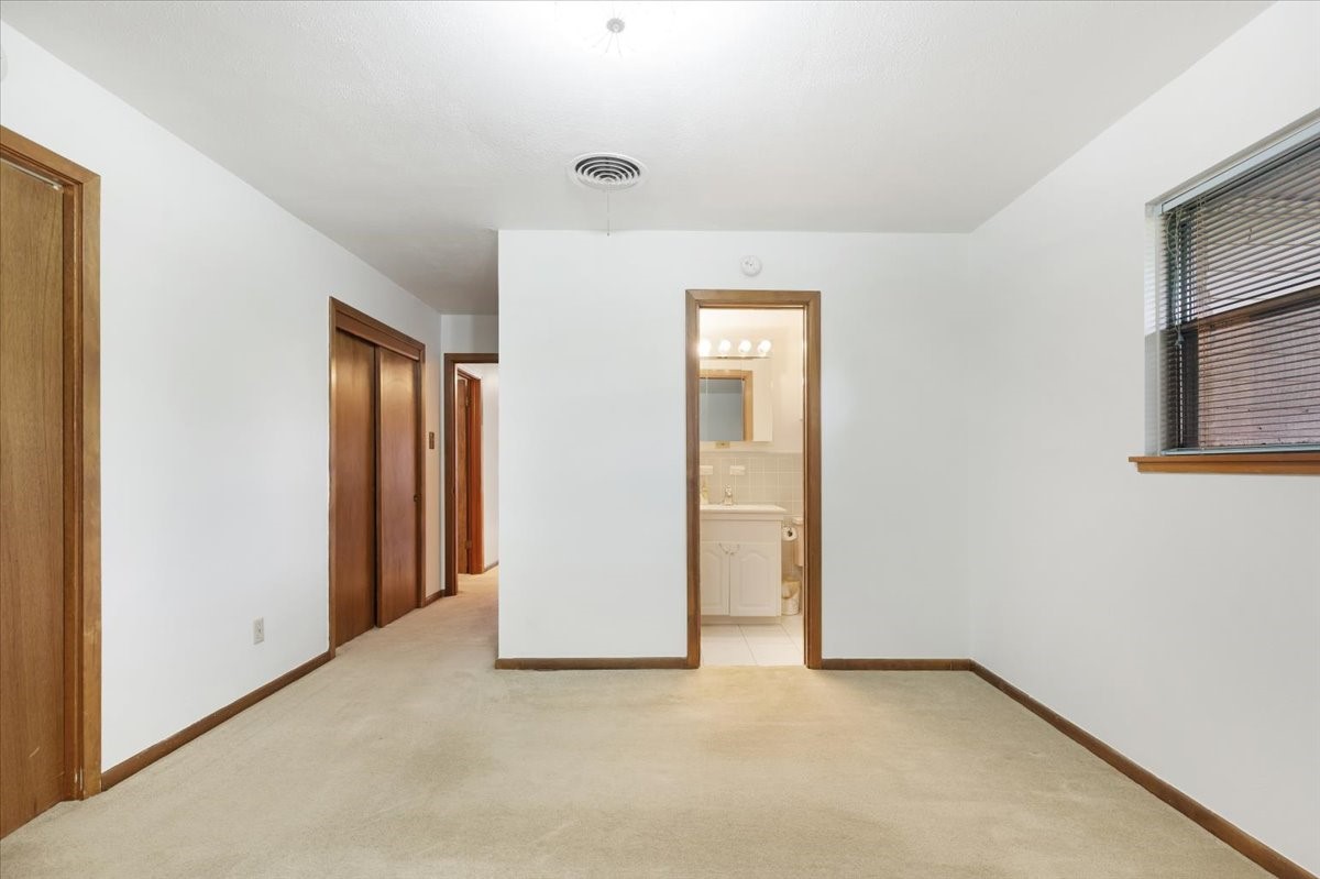1403 Marlock Lane Pasadena, TX 77502 - Photo 16 of 32 an empty room with windows and closet