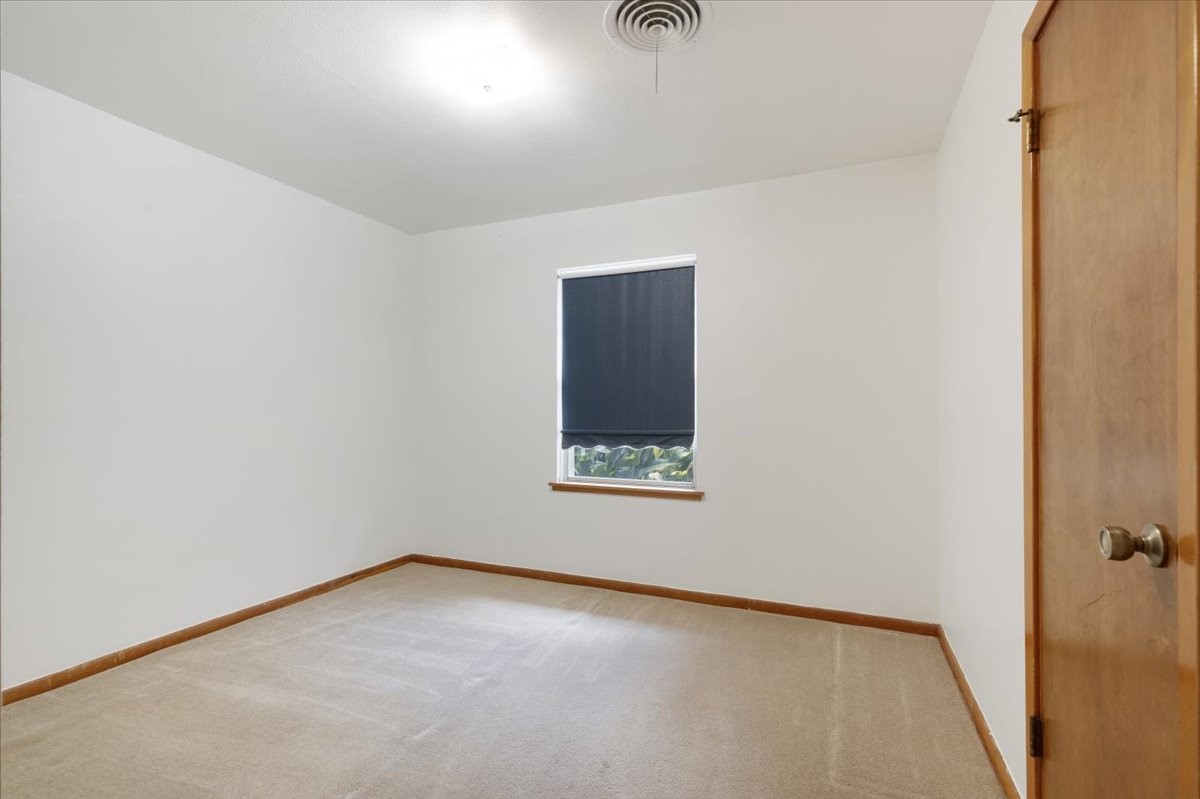 1403 Marlock Lane Pasadena, TX 77502 - Photo 21 of 32 a view of an empty room with a window