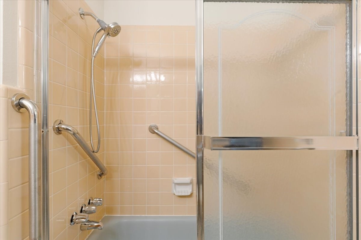 1403 Marlock Lane Pasadena, TX 77502 - Photo 25 of 32 a bathroom with a shower and a shower