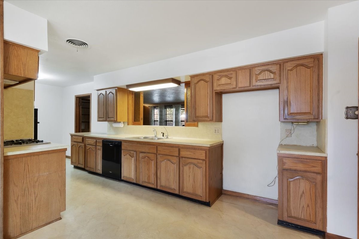 1403 Marlock Lane Pasadena, TX 77502 - Photo 9 of 32 a bathroom with a granite countertop double vanity sink and mirror