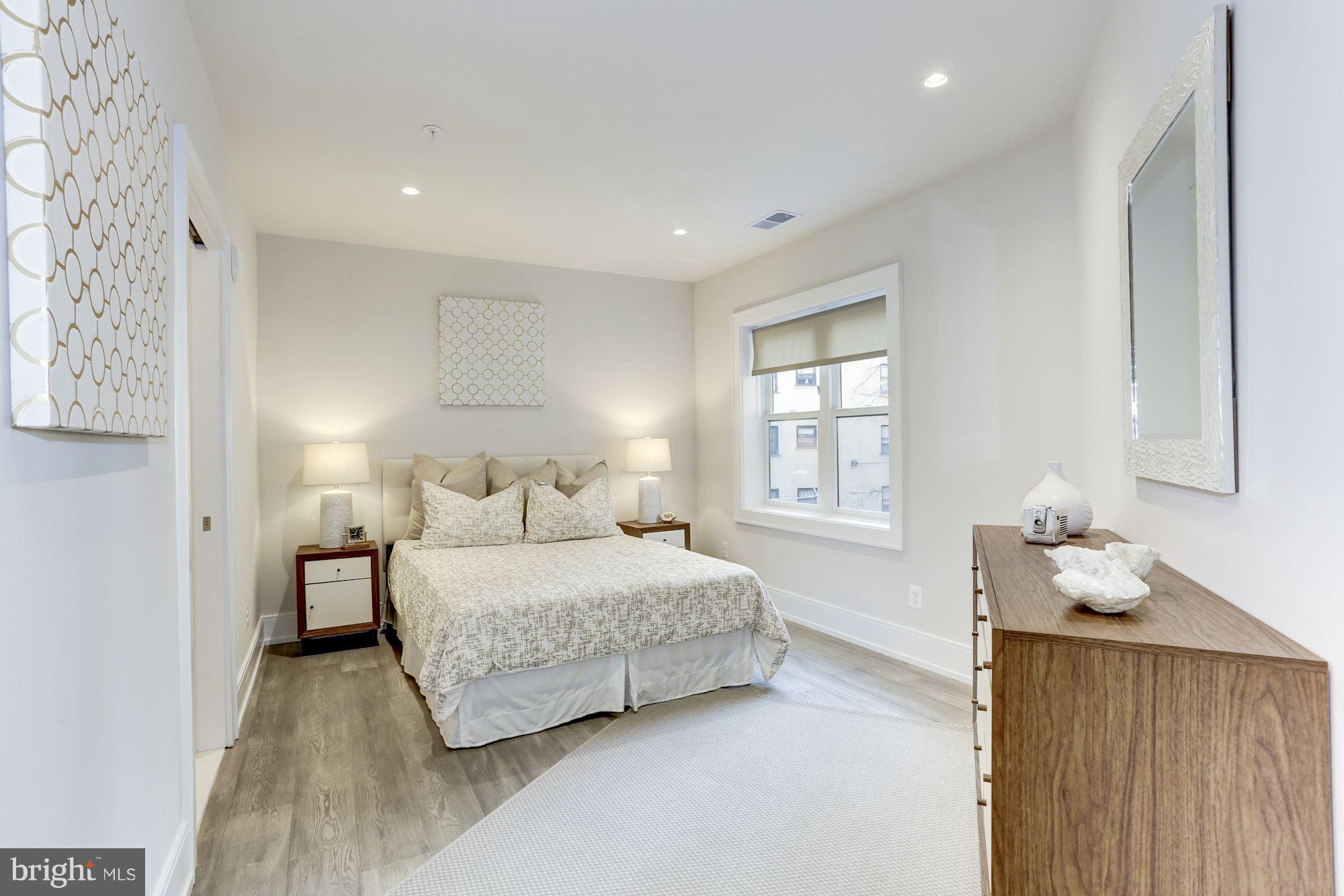 2434 16th Street Northwest, Unit 301 Washington, DC 20009 - Photo 17 of 30 a bedroom with a bed and window