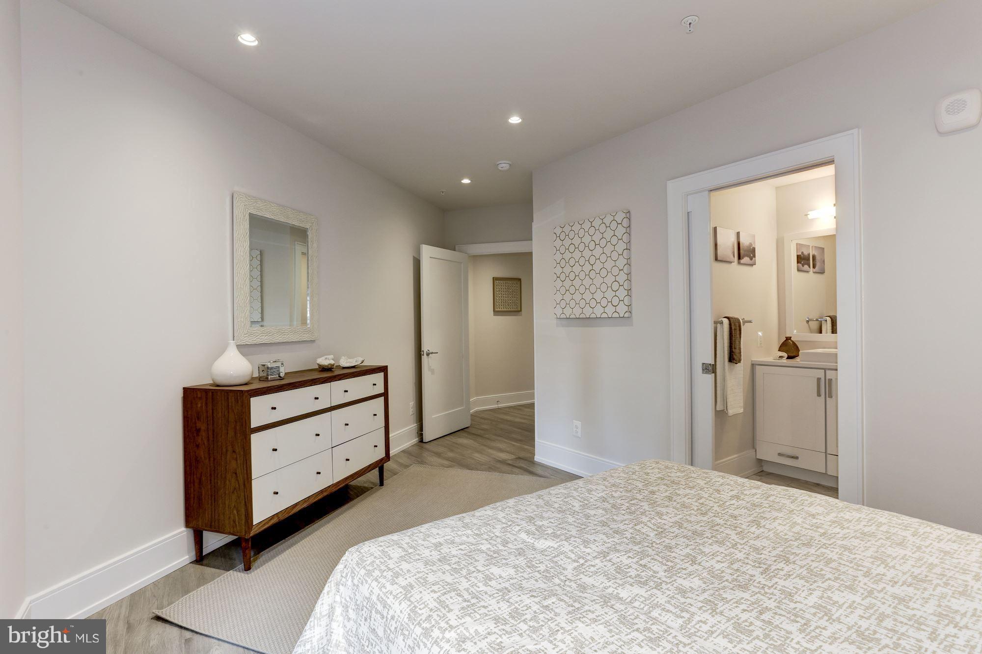 2434 16th Street Northwest, Unit 301 Washington, DC 20009 - Photo 19 of 30 a room with a bed and a dresser