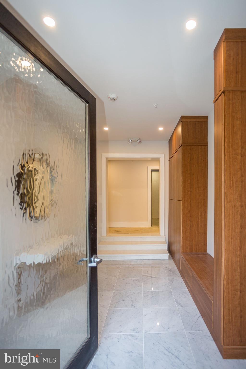 2434 16th Street Northwest, Unit 301 Washington, DC 20009 - Photo 3 of 30 a view of entryway with a door and wooden floor
