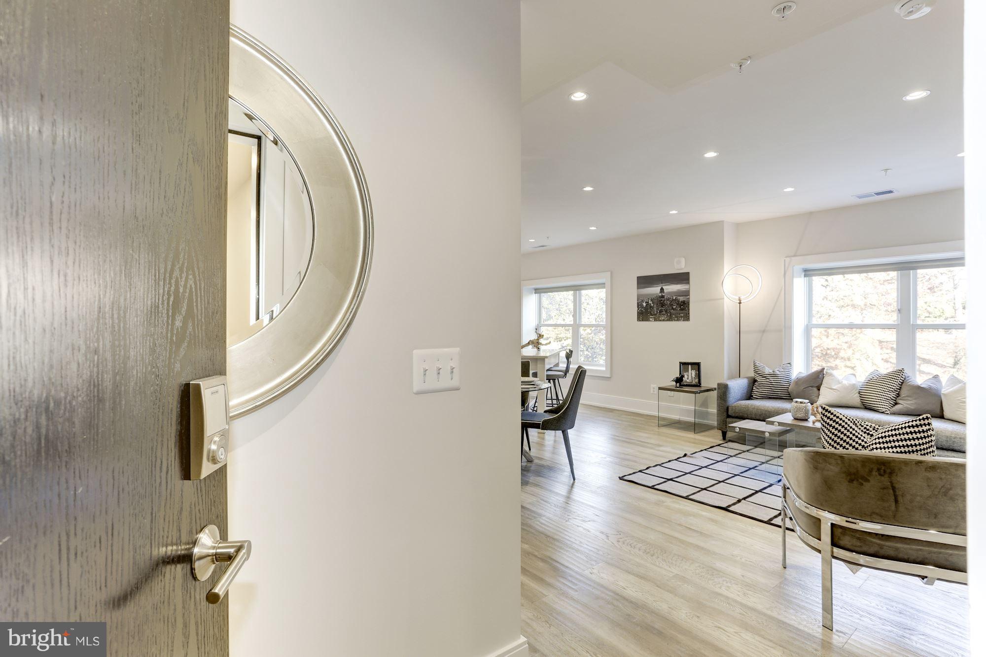 2434 16th Street Northwest, Unit 301 Washington, DC 20009 - Photo 5 of 30 an entryway and livingroom with furniture