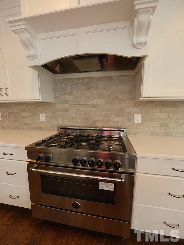 2004 Wiggs Street Raleigh, NC 27608 - Photo 11 of 25 a stove top oven sitting inside of a kitchen