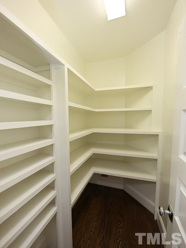 2004 Wiggs Street Raleigh, NC 27608 - Photo 14 of 25 a storage room with wooden floor