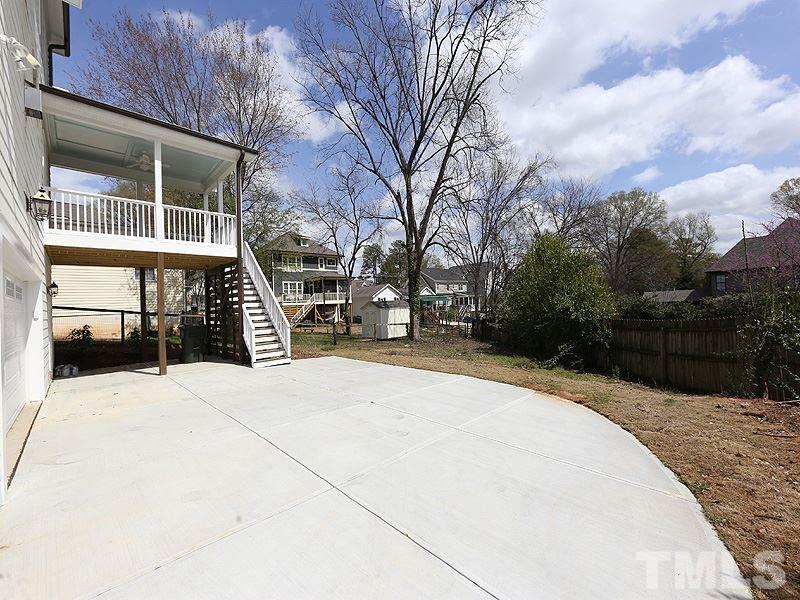 2004 Wiggs Street Raleigh, NC 27608 - Photo 24 of 25 a house with trees in front of it
