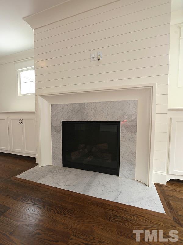 2004 Wiggs Street Raleigh, NC 27608 - Photo 8 of 25 a living room with a fireplace