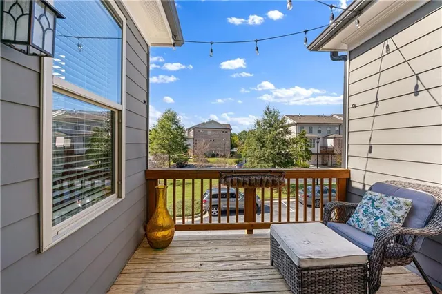a view of a balcony with wooden floor