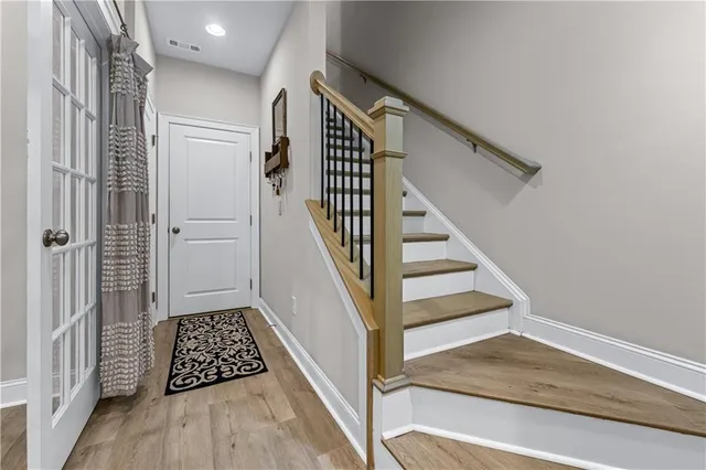 a view of wooden floor and entryway