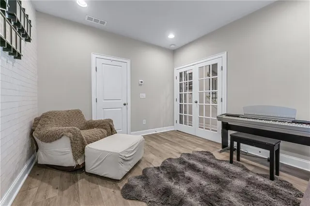 a bedroom with furniture and a window
