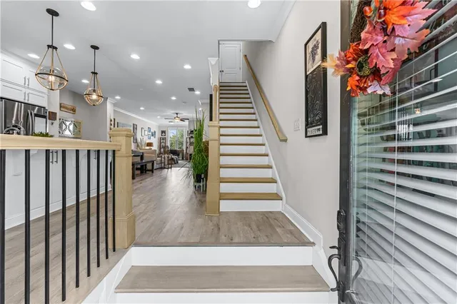 a view of entryway and hall with wooden floor
