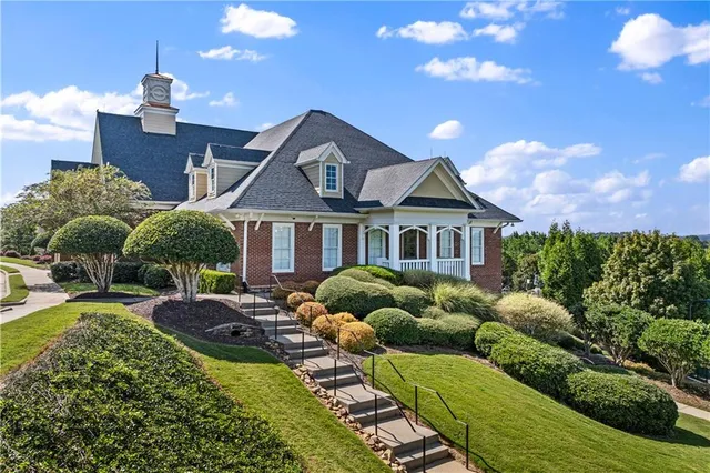 a front view of a house with garden