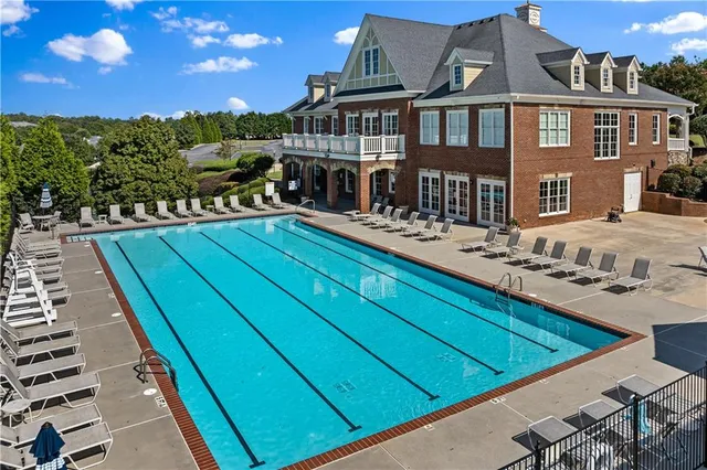 a view of a house with pool deck and city view