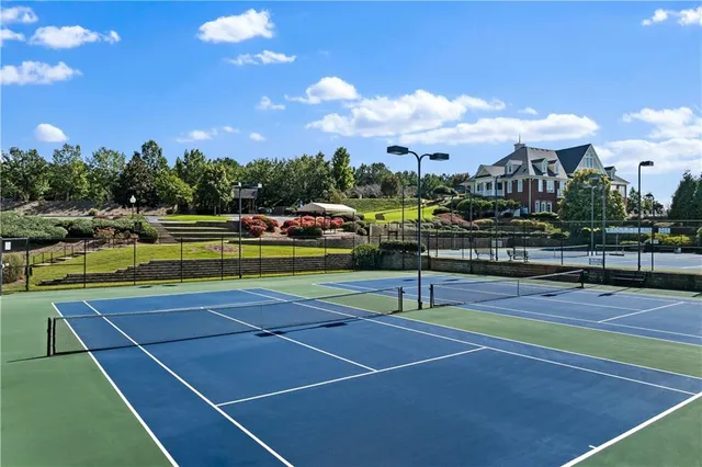 a view of an outdoor space and tennis court