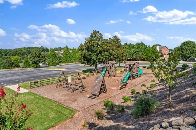 a view of a patio with table and chairs and potted plants