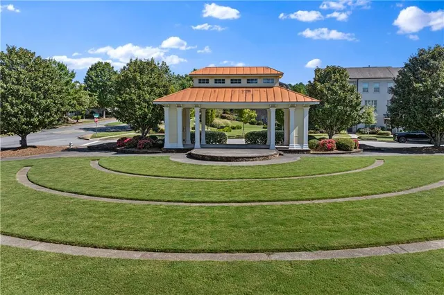 a view of a park with large trees