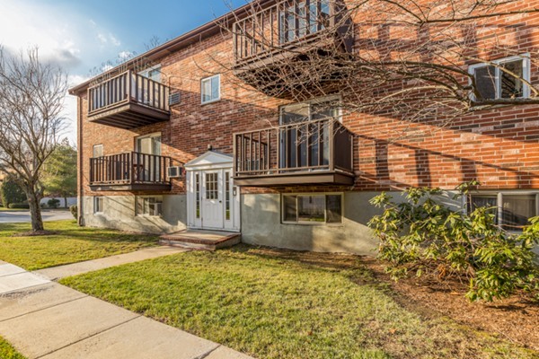 34 Westgate Road, Unit 5 Boston, MA 02467 - Photo 2 of 18 a front view of a house with a yard
