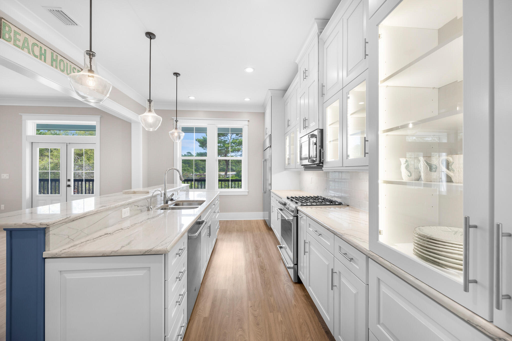 61 Blue Lake Road Santa Rosa Beach, FL 32459 - Photo 14 of 66 a large kitchen with granite countertop a large window and white appliances
