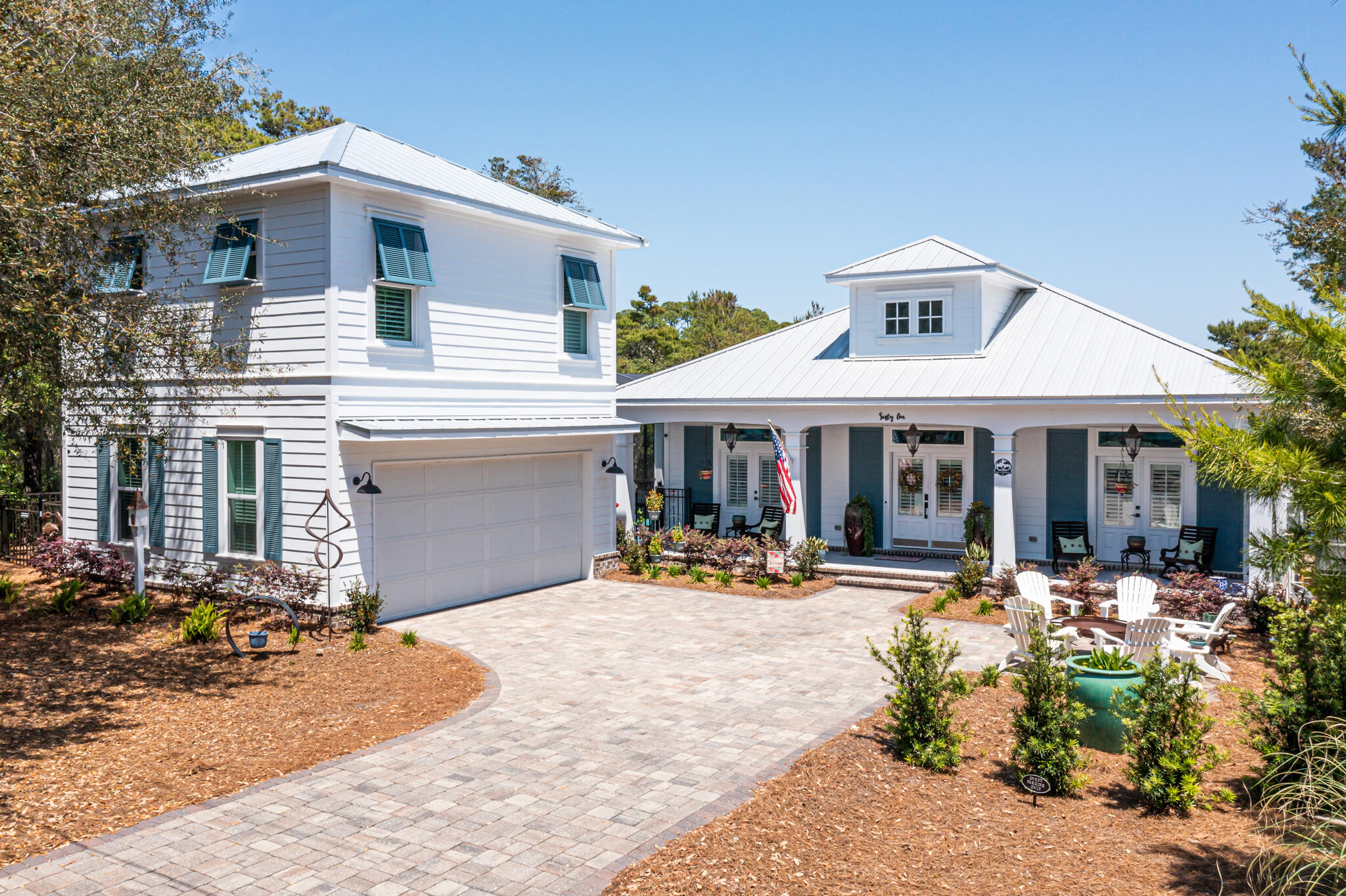 61 Blue Lake Road Santa Rosa Beach, FL 32459 - Photo 2 of 66 a front view of a house with a patio
